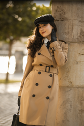 a lady in a white lapel shirt and a long trench coat